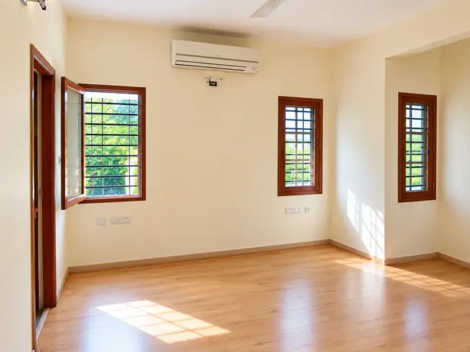RT Nagar independent house interior with spacious rooms, wooden flooring and large windows.