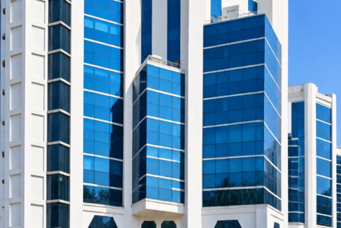 Embassy Heights commercial office building with modern blue glass facade.